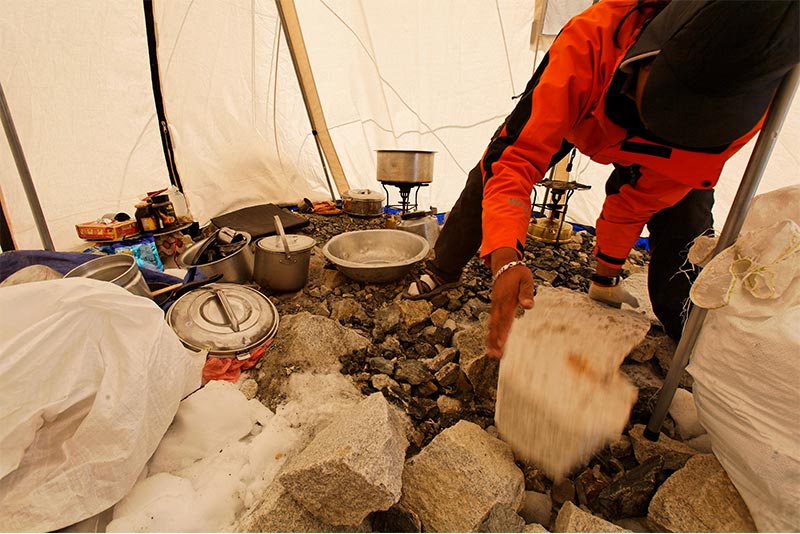 Tawa adds rocks to the kitchen tent