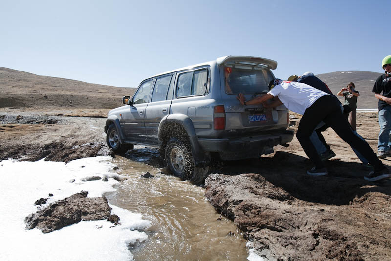 stuck - pushing the land cruiser
