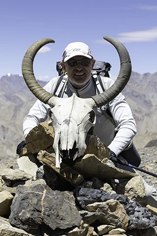 Jamie McGuinness with wild yak horns in Ladakh Jamie McGuinness, Project Himalaya owner-guide with a wild yak skull and horns